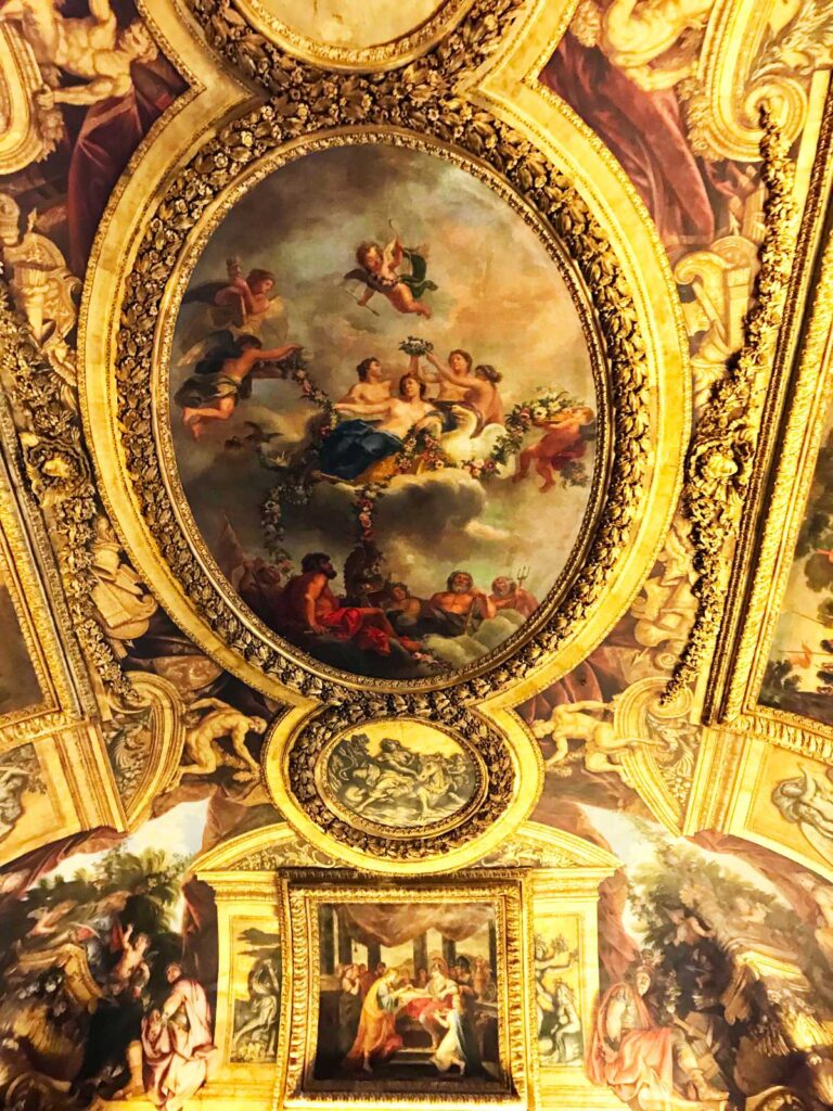 Golden ceiling with paintings at Versailles