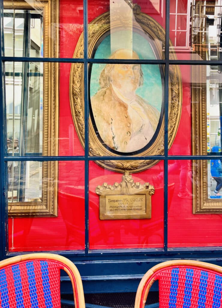 Portrait of US ambassador to France (future US founding father), Benjamin Franklin, in the window of La Procope