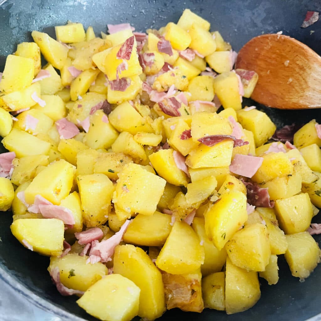 Cooking the potatoes and ham